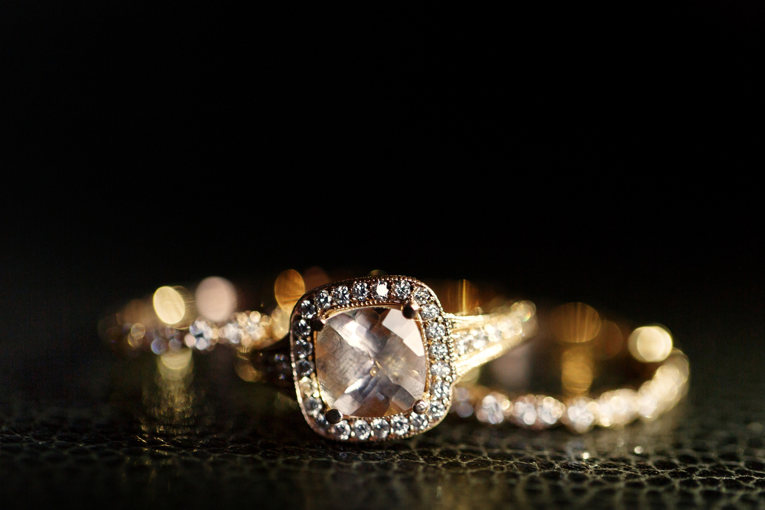 jewels-sparkle-golden-wedding-rings-lying-leather